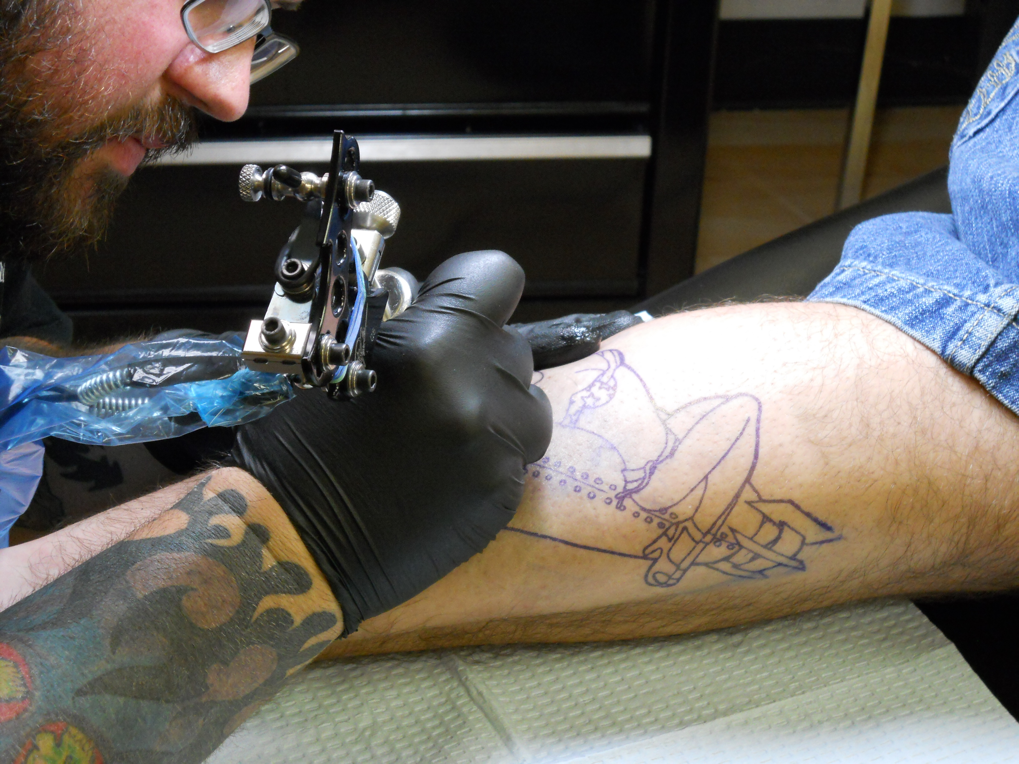 A close up of Chris working on a calf muscle