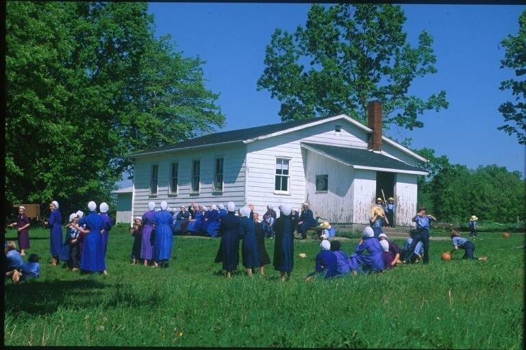 This picture shows a common scene of Amish children playing at recess.