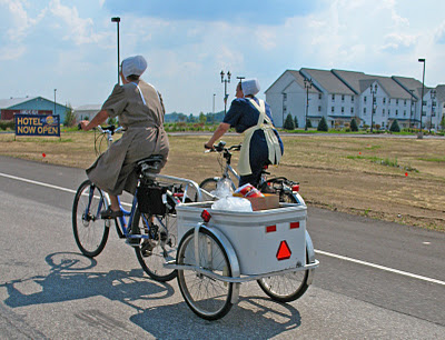 This is a picture of Amish women riding bicycles.